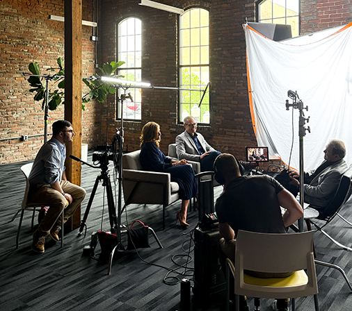 a photo of a video recording process of two people talking