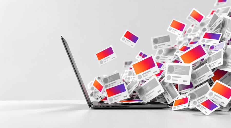 Laptop surrounded by digital content cards.