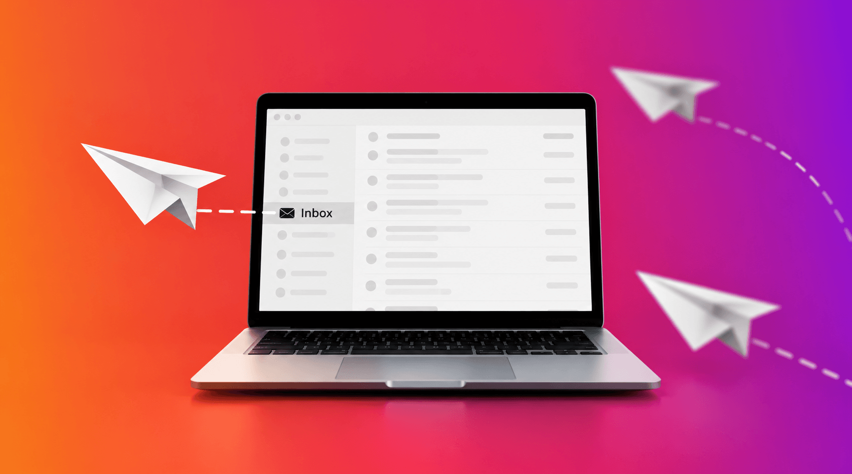 Laptop displaying an email inbox with paper airplanes.